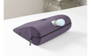 Liberator Axis Wand Toy Mount Sex Pillow with wand inserted - Plum